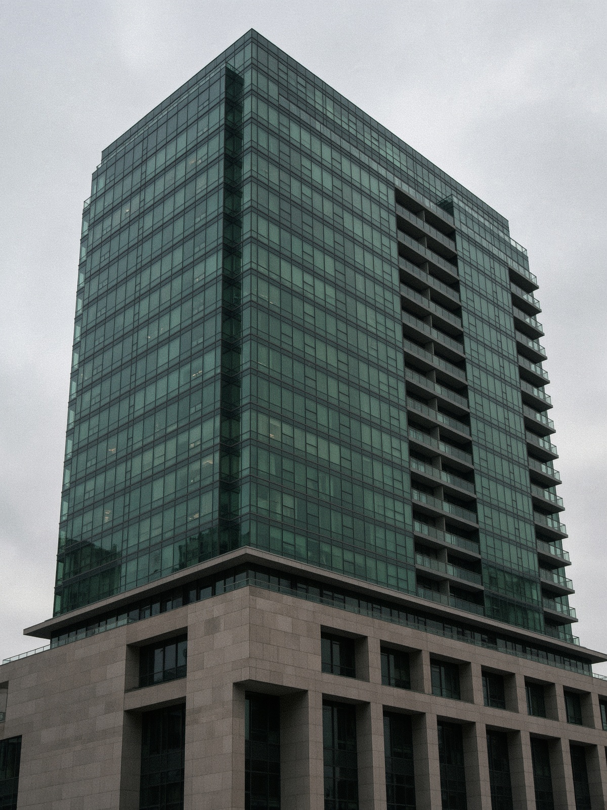 A glass condominium tower